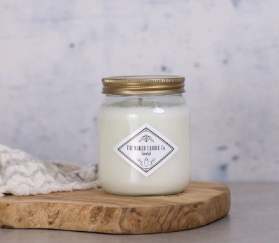 The Naked Candle Co Santal soy candle with fresh marine, citrus, sandalwood and amber fragrance notes.
